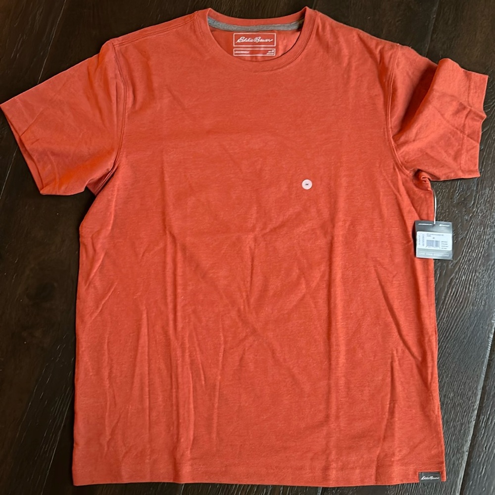 New with tags, orange LEGENDWASH men’s Eddie Bauer tshirt, size medium.